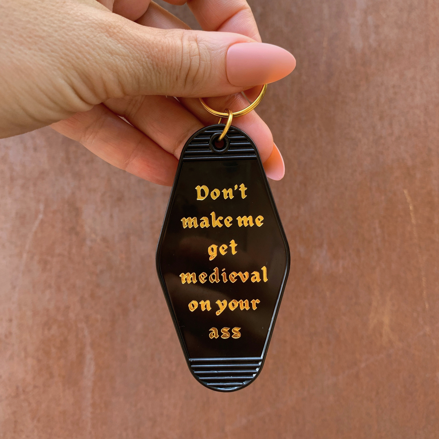 Don't Make Me Get Medieval on Your Ass Motel Keychain Black