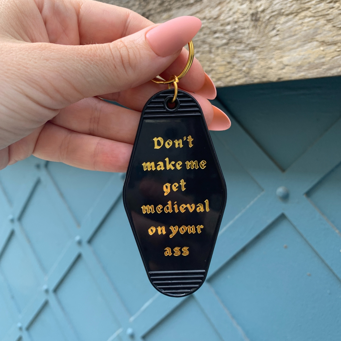 Don't Make Me Get Medieval on Your Ass Motel Keychain Black